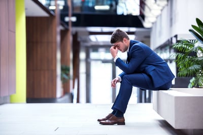 frustrated young business man working on laptop computer at office-1