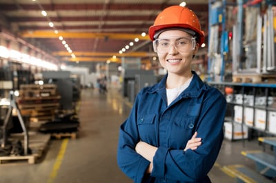 Smiling female engineer in a warehouse