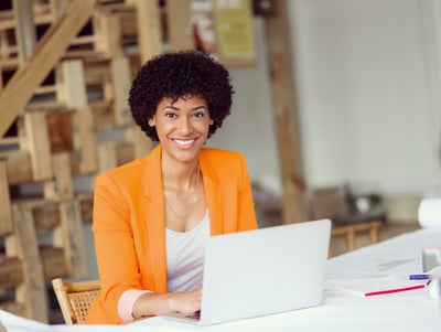 Smiling businesswoman with a laptop