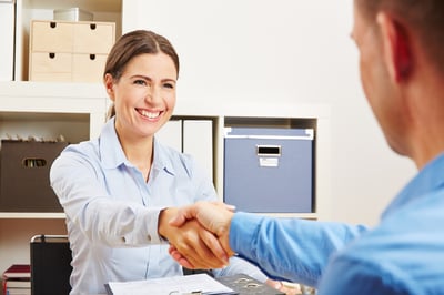 shaking customer hand - turning lead to a customer